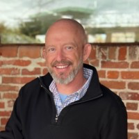 Portrait of Adam Lambert-Gorwyn, AI Architect & Digital Strategist